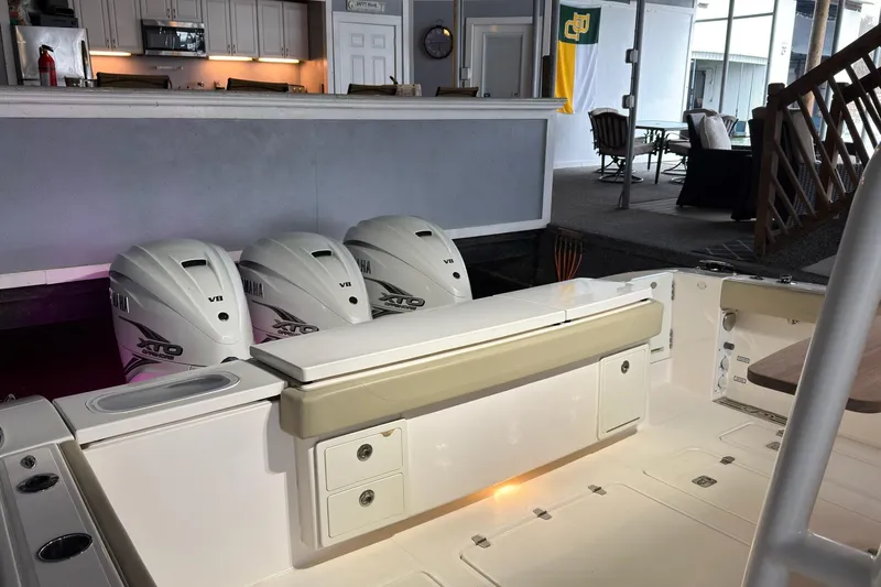  Yacht Photos Pics 2019 Pursuit S 408 Sport boat with Yamaha XTO V8 engines docked indoors.