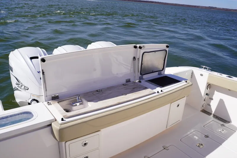  Yacht Photos Pics 2019 Pursuit S 408 Sport boat with open deck kitchen and Yamaha engines.