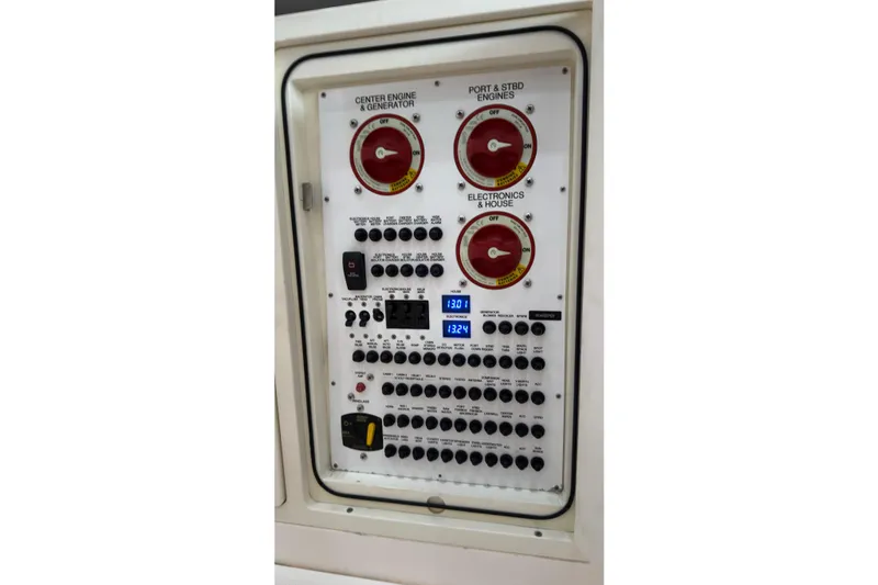  Yacht Photos Pics Control panel of a 2019 Pursuit S 408 Sport boat with switches and gauges.