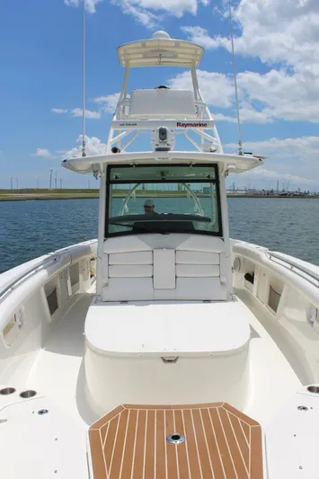  Yacht Photos Pics 2013 Boston Whaler 370 Outrage boat on water, clear sky, spacious deck.