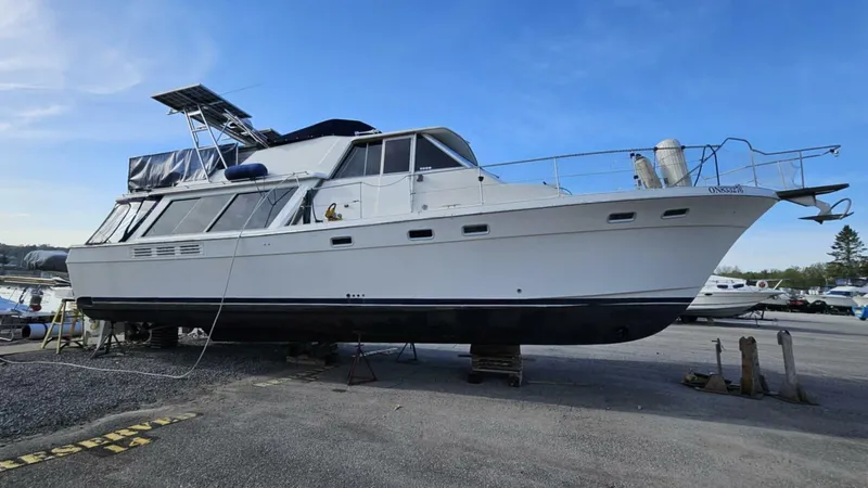  Yacht Photos Pics 1988 Bayliner 4550/4558 Pilothouse yacht on dry dock, featuring a sleek white hull.