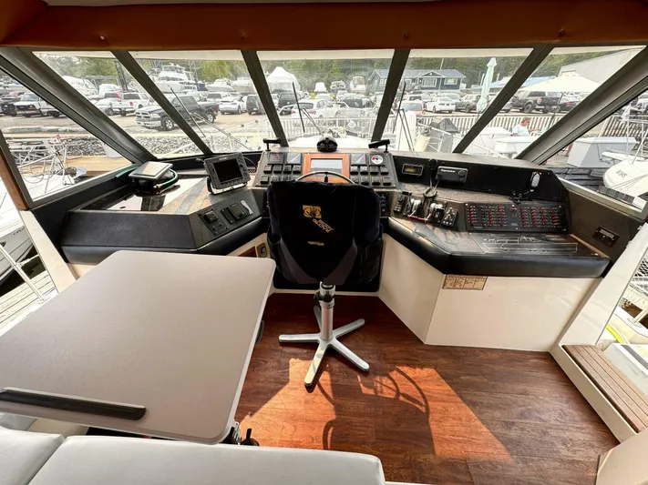  Yacht Photos Pics 1988 Bayliner 4550/4558 Pilothouse interior with helm, navigation equipment, and seating area.