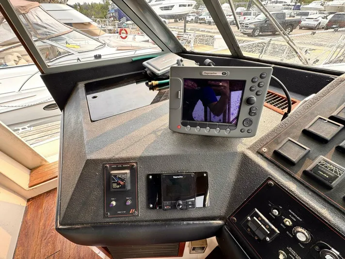  Yacht Photos Pics 1988 Bayliner 4550 Pilothouse helm with navigation equipment and controls.