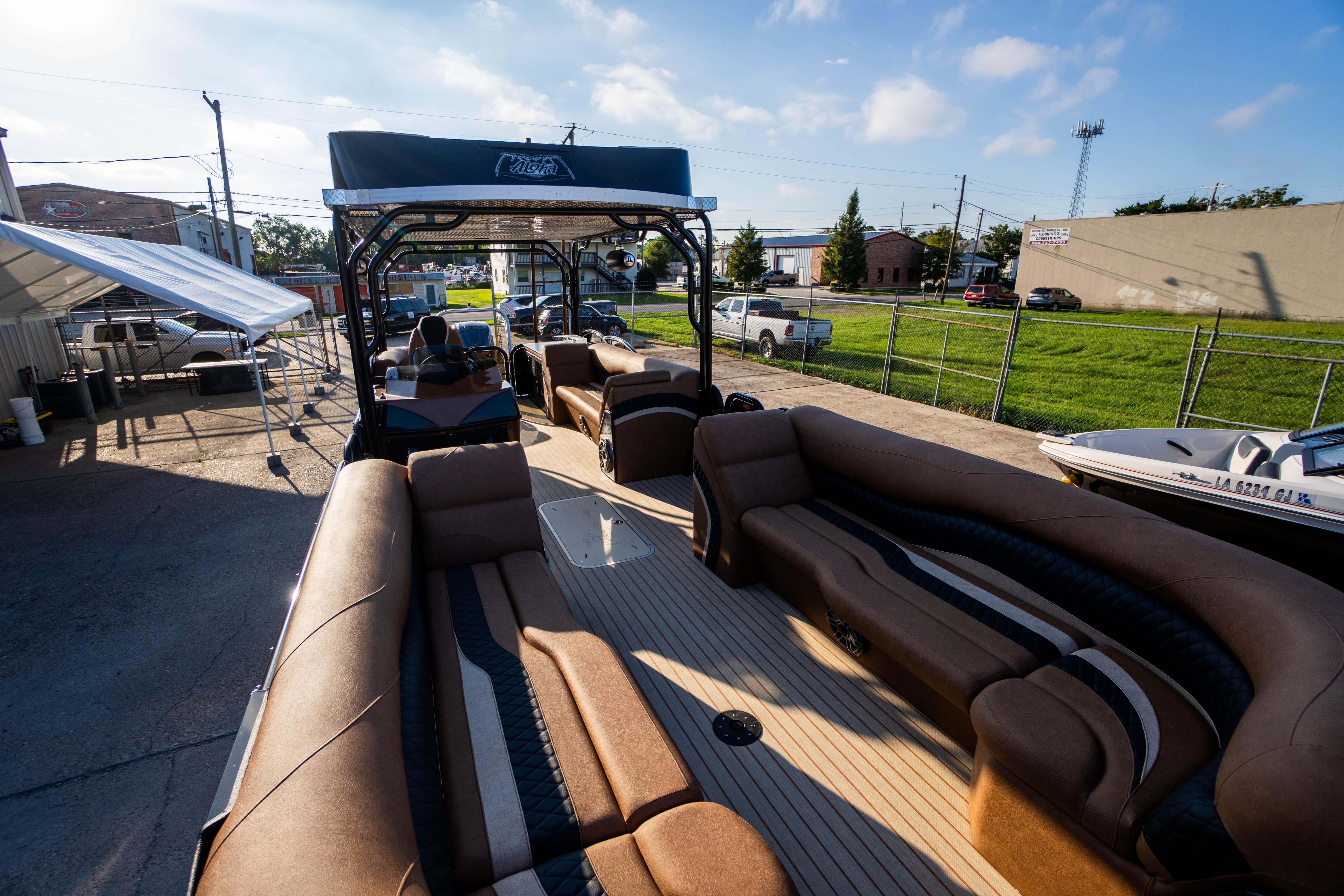 2026 Aloha Paradise 300 Sundeck boat with luxurious seating and modern design.