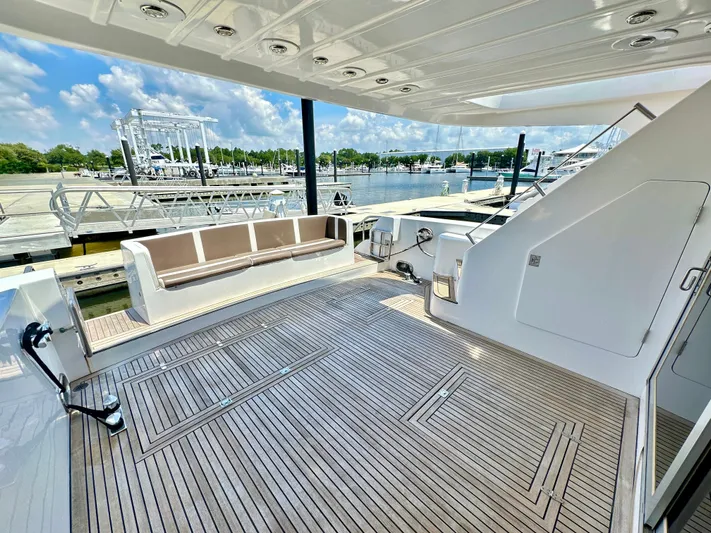 Antiquity Yacht Photos Pics 1998 TransWorld Cruiser yacht deck with seating area at marina.