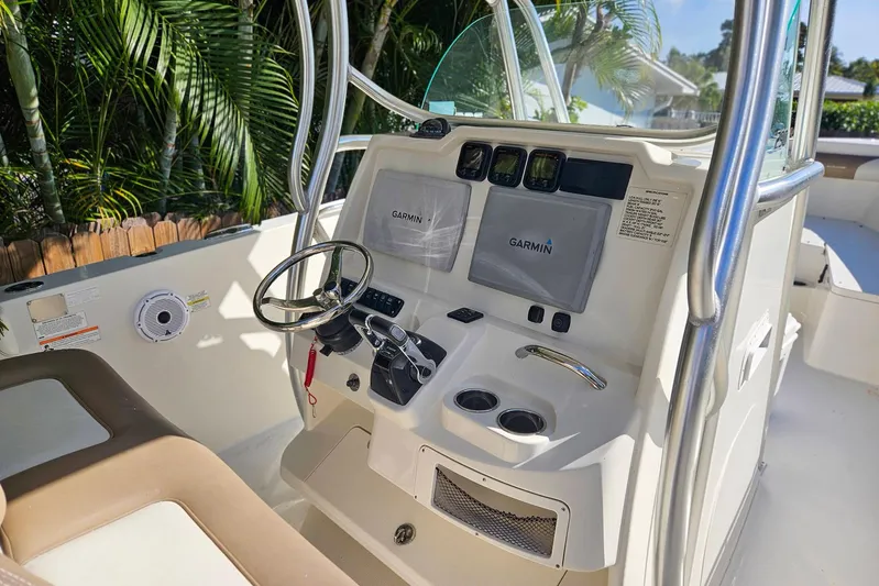 Buddy Yacht Photos Pics 2013 Sailfish 290 CC boat dashboard with Garmin navigation system and steering wheel.