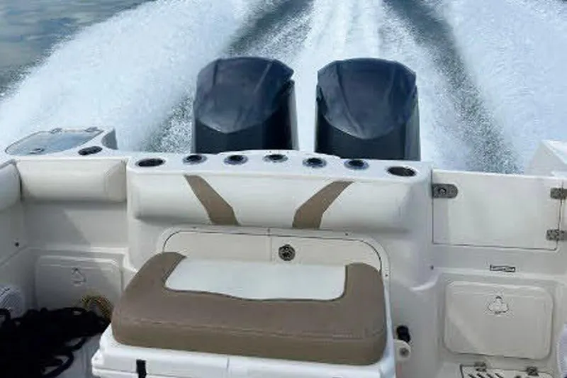 Buddy Yacht Photos Pics 2013 Sailfish 290 CC boat with dual engines cruising on water.