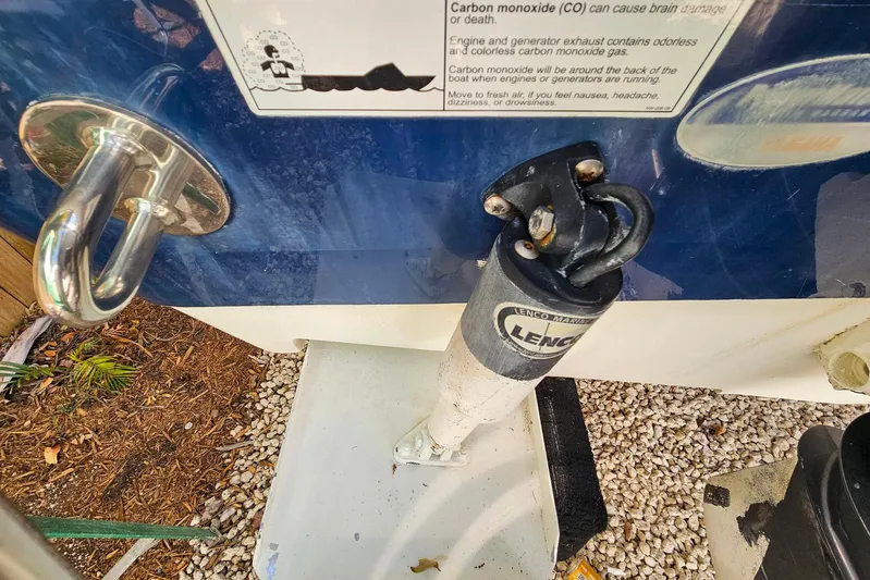 Buddy Yacht Photos Pics 2013 Sailfish 290 CC boat detail showing Lenco trim tab and warning label.