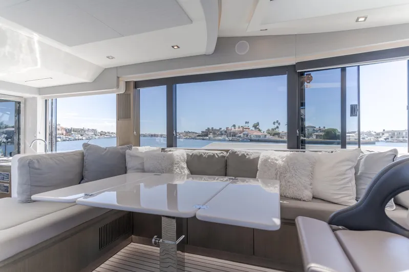 Saigon Yacht Photos Pics Luxurious interior of 2023 OKEAN 52 Fly yacht with plush seating and ocean view.