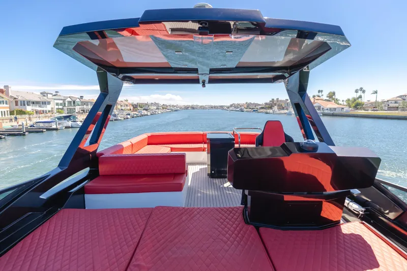 Saigon Yacht Photos Pics Luxurious 2023 OKEAN 52 Fly yacht interior with red seating and modern design.
