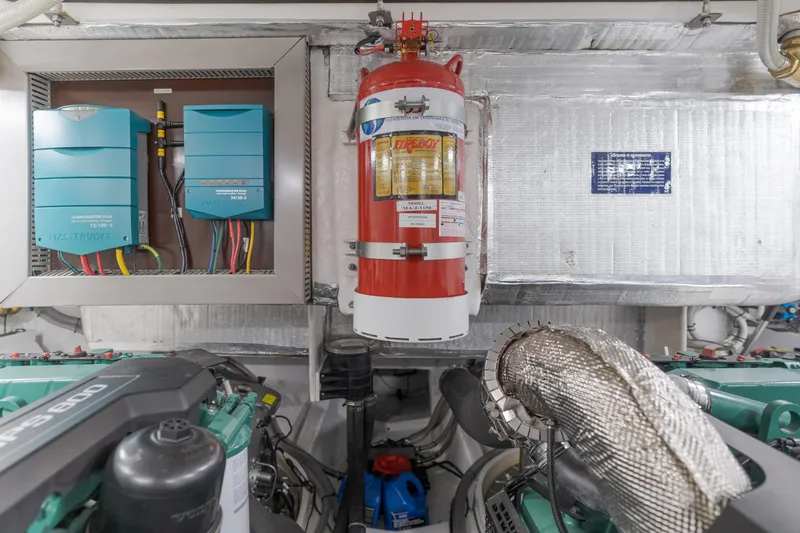 Saigon Yacht Photos Pics Engine room of 2023 OKEAN 52 Fly yacht with fire extinguisher and electrical systems.