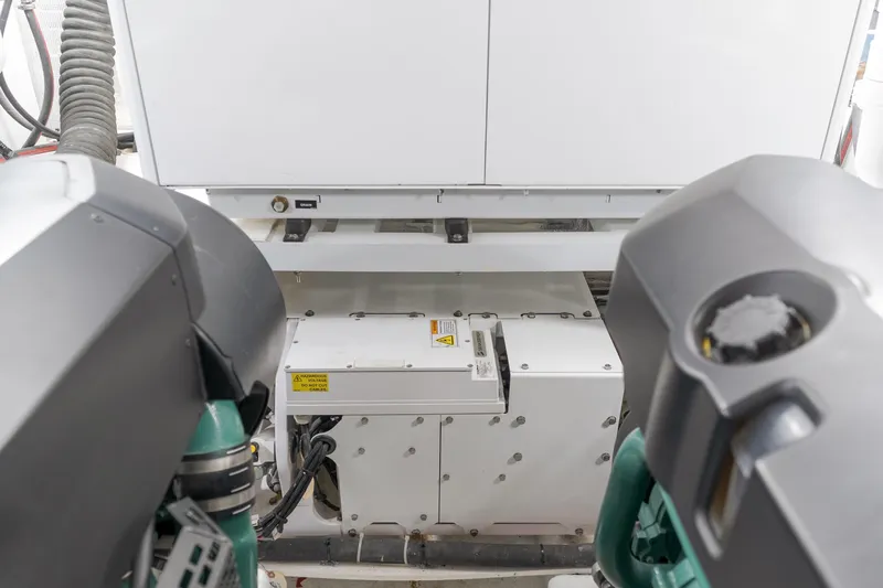 Saigon Yacht Photos Pics Engine room of 2023 OKEAN 52 Fly yacht, showcasing mechanical components and equipment.