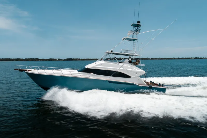 Relentless Yacht Photos Pics 2006 Bertram Sportfish yacht cruising on open water, showcasing sleek design and powerful performance.