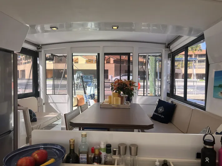 Encore Yacht Photos Pics Interior of 2020 Bali 4.1 catamaran with dining area and panoramic windows.