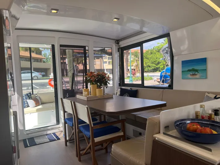 Encore Yacht Photos Pics Interior of 2020 Bali 4.1 catamaran with dining area and large windows.