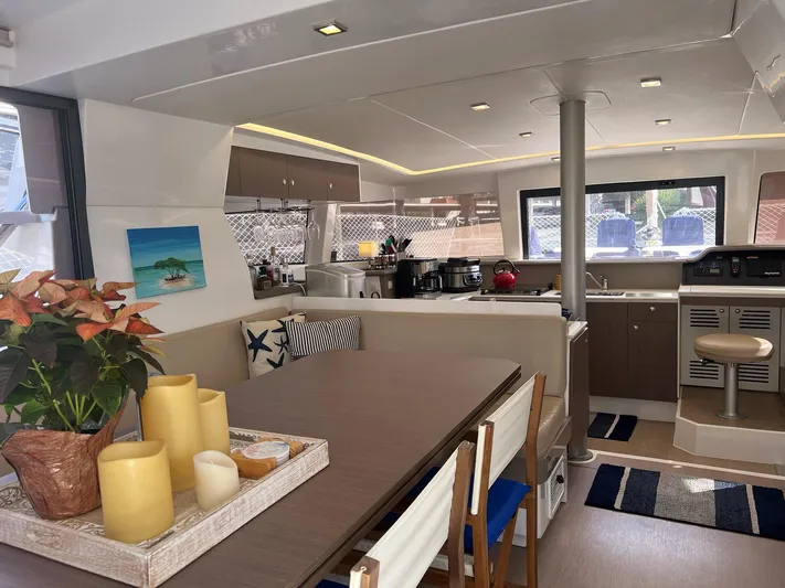 Encore Yacht Photos Pics Luxurious interior of 2020 Bali 4.1 catamaran with modern kitchen and dining area.