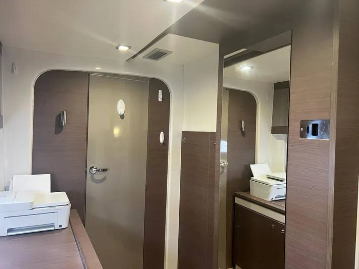 Encore Yacht Photos Pics Interior of Bali 4.1 yacht, featuring modern wood paneling and office equipment, 2020 model.