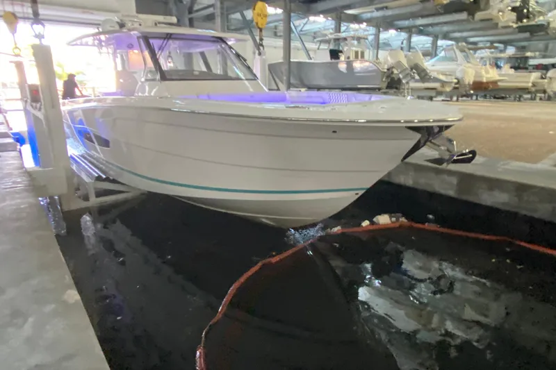  Yacht Photos Pics 2021 Regal 38 SAV boat docked indoors with blue lighting.