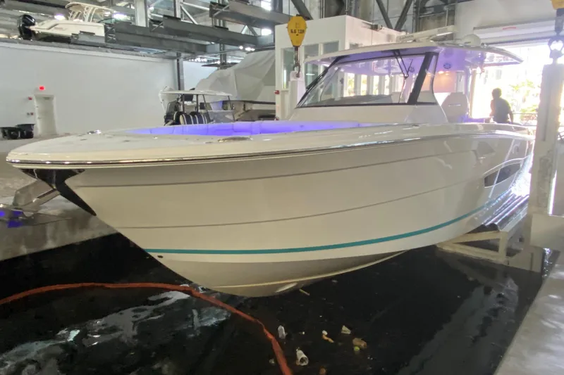  Yacht Photos Pics 2021 Regal 38 SAV boat displayed indoors with modern design and sleek lines.