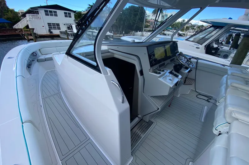  Yacht Photos Pics 2021 Regal 38 SAV boat interior with helm, seating, and navigation equipment.