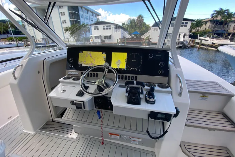  Yacht Photos Pics 2021 Regal 38 SAV boat helm with modern navigation displays and controls.
