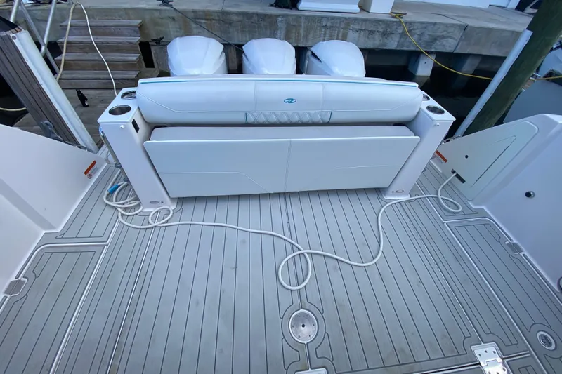  Yacht Photos Pics 2021 Regal 38 SAV boat deck with seating and outboard engines.