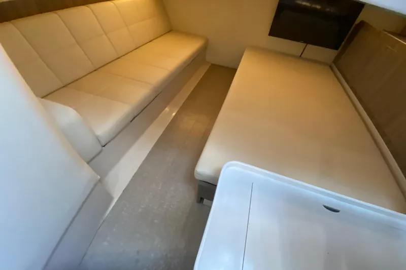  Yacht Photos Pics Interior of 2021 Regal 38 SAV boat with beige seating and modern design.