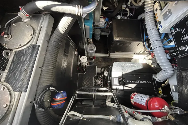  Yacht Photos Pics Engine room of 2022 Amel 50 yacht with Volvo Penta engine and fire extinguisher.