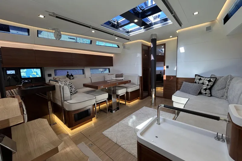  Yacht Photos Pics Luxurious interior of 2022 Amel 50 yacht with modern furnishings and ambient lighting.