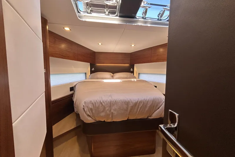  Yacht Photos Pics Luxurious cabin interior of 2022 Amel 50 yacht with cozy bed and modern design.