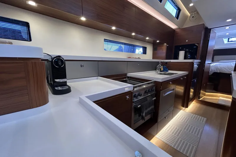  Yacht Photos Pics Modern kitchen interior of 2022 Amel 50 yacht with sleek design and appliances.