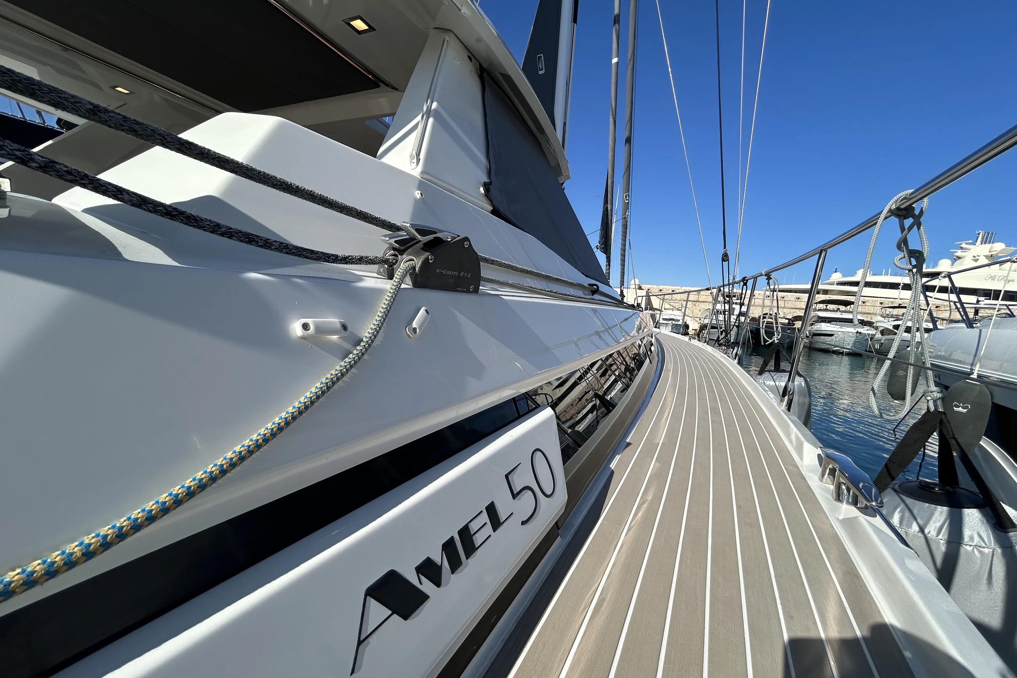 2022 Amel 50 yacht deck with sleek design and marina view.