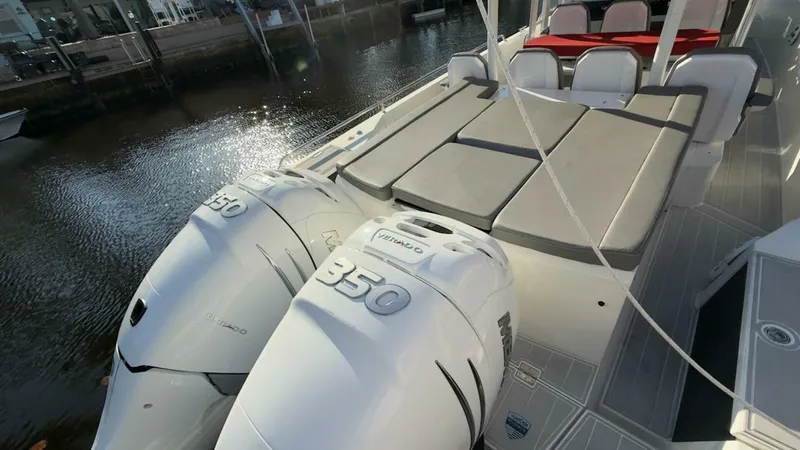 No Name Yacht Photos Pics 2019 Axopar 37 Sun Top with twin 350 engines, docked by the water.
