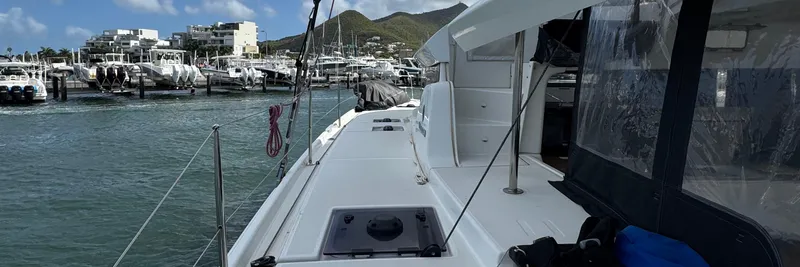 Samcat Yacht Photos Pics Lagoon 46 catamaran docked at marina, showcasing sleek design and modern features, 2020 model.