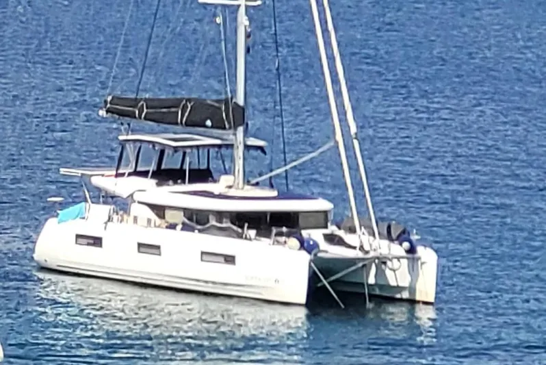 Samcat Yacht Photos Pics 2020 Lagoon 46 catamaran sailing on calm blue waters.
