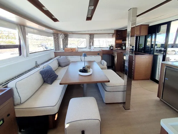 Samcat Yacht Photos Pics Luxurious interior of 2020 Lagoon 46 catamaran with modern seating and dining area.