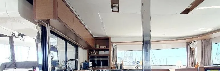 Samcat Yacht Photos Pics Interior of 2020 Lagoon 46 yacht, featuring modern kitchen and panoramic windows.