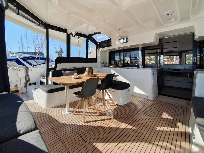 Samcat Yacht Photos Pics Spacious interior of 2020 Lagoon 46 catamaran with elegant dining area and modern design.