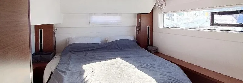 Samcat Yacht Photos Pics Interior cabin of 2020 Lagoon 46 yacht with cozy bed and modern design.