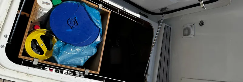 Samcat Yacht Photos Pics Storage compartment on a 2020 Lagoon 46 yacht with various equipment and supplies.