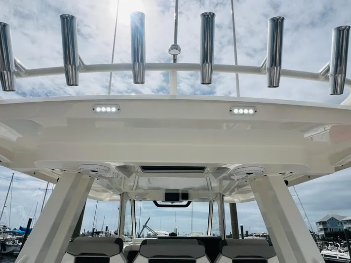  Yacht Photos Pics 2022 Pursuit S 358 Sport boat with rod holders and sleek design.