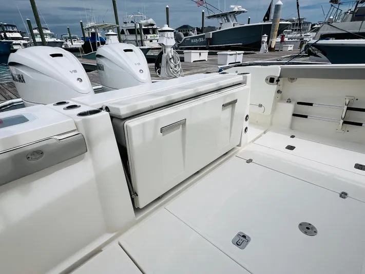  Yacht Photos Pics 2022 Pursuit S 358 Sport boat deck with Yamaha engines at marina.