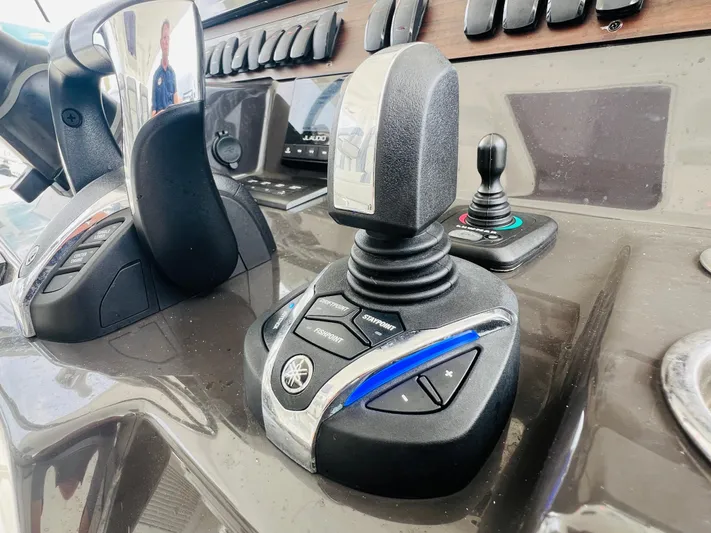  Yacht Photos Pics Close-up of 2022 Pursuit S 358 Sport boat controls and joystick.