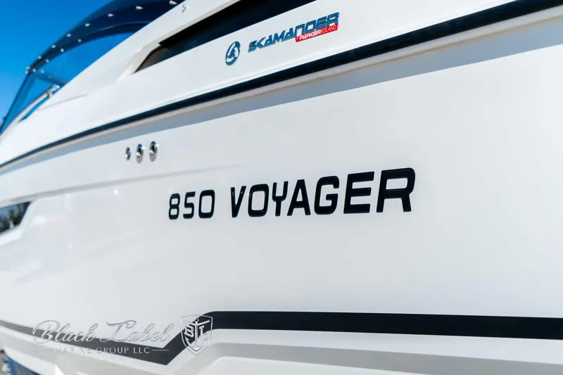 Ocean Phantom Yacht Photos Pics Hussar 850 Voyager boat, 2023 model, sleek white design with branding details.