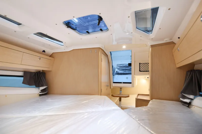 Ocean Phantom Yacht Photos Pics Interior of 2023 Hussar 850 camper, featuring modern design and spacious sleeping area.