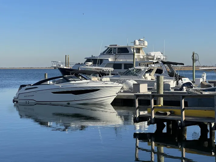 Ocean Phantom Yacht Photos Pics Luxury boats docked at marina, featuring 2023 Hussar 850 model.