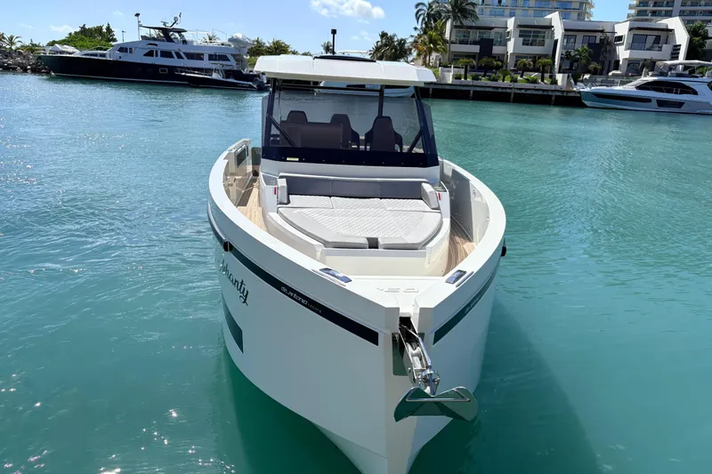 Casa - Ashanty Yacht Photos Pics 2025 De Antonio Yachts D32 in marina, sleek design, turquoise water, luxury boat.