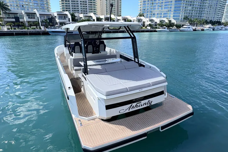 Casa - Ashanty Yacht Photos Pics 2025 De Antonio Yachts D32 luxury yacht docked in a marina with modern buildings.