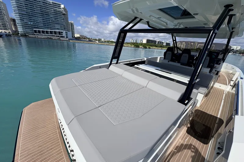 Casa - Ashanty Yacht Photos Pics 2025 De Antonio Yachts D32 luxury yacht with spacious deck and modern design in a marina.