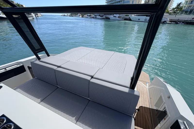 Casa - Ashanty Yacht Photos Pics Luxurious 2025 De Antonio Yachts D32 with spacious seating, docked in a serene marina.